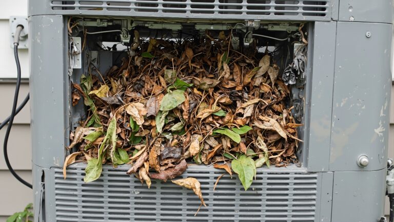 Clogged outdoor AC unit vents stuffed with dense mix of dry and damp leaves This is a blog about needing to hire a professional for an air conditioning repair emergency.